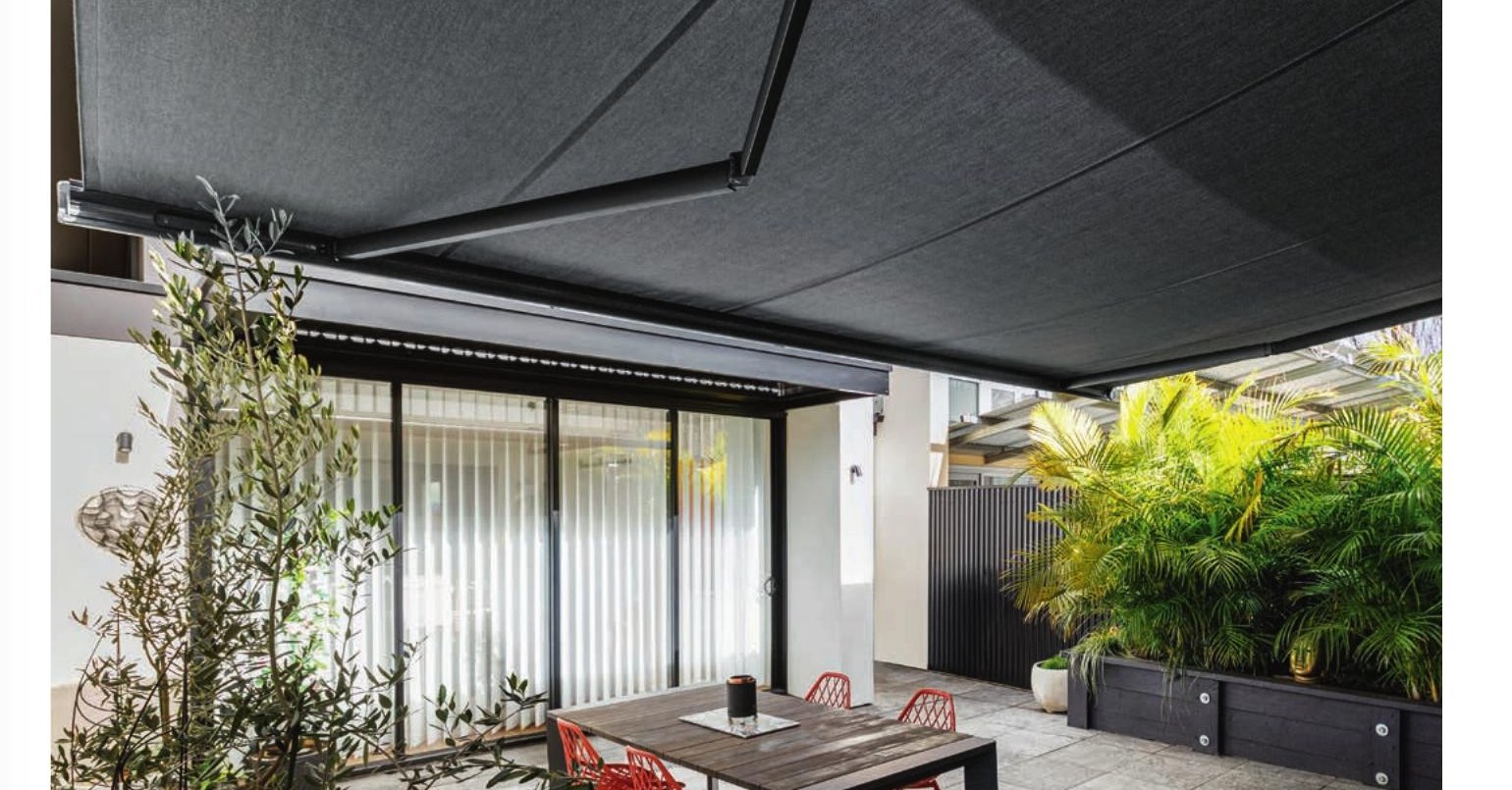 Siena Donatello cassette folding arm awning over an alfresco dining area