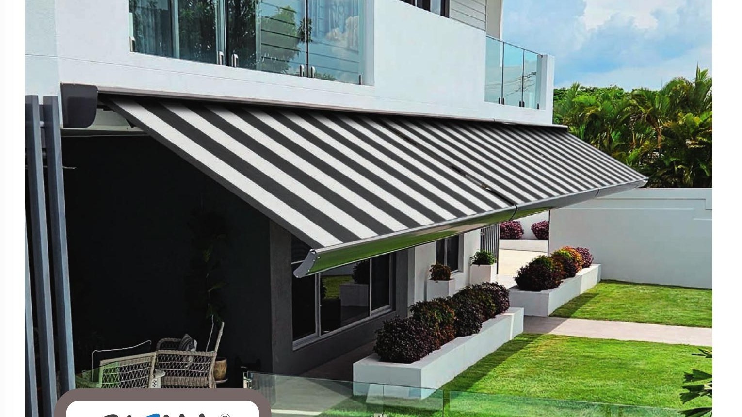 Striped Siena semi-cassette folding arm awning on a modern home